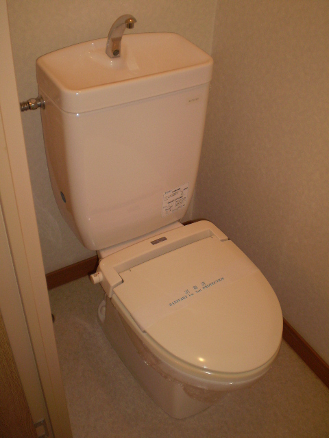 Toilet. Heating toilet seat equipped