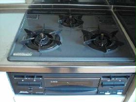 Kitchen. 3 is a gas stove with a with a neck of the grill