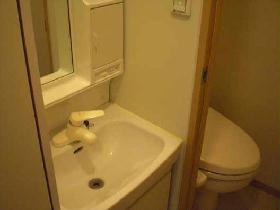 Washroom. It is a wash basin and toilet. It is with warm water washing toilet seat.