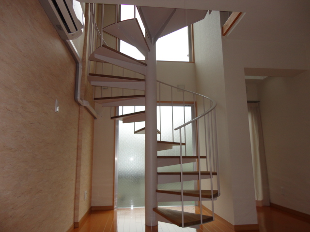 Living and room. Indoor spiral staircase