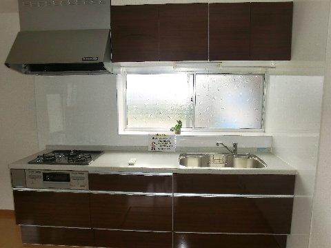 Kitchen. System K Brand new Above storage Exhaust Fan With gas stove