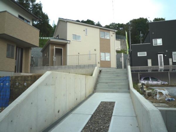 Local appearance photo. Entrance is if go up the little stairs from the parking space.