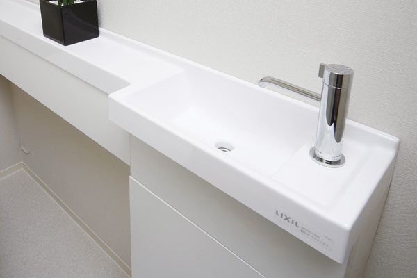 Toilet.  [Hand wash basin on earth counter] Standard equipped with a functional and smart form is beautiful hand washing counter to all households. Will produce a sophisticated toilet space (same specifications)