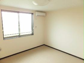 Living and room. There is also a room without furniture appliances