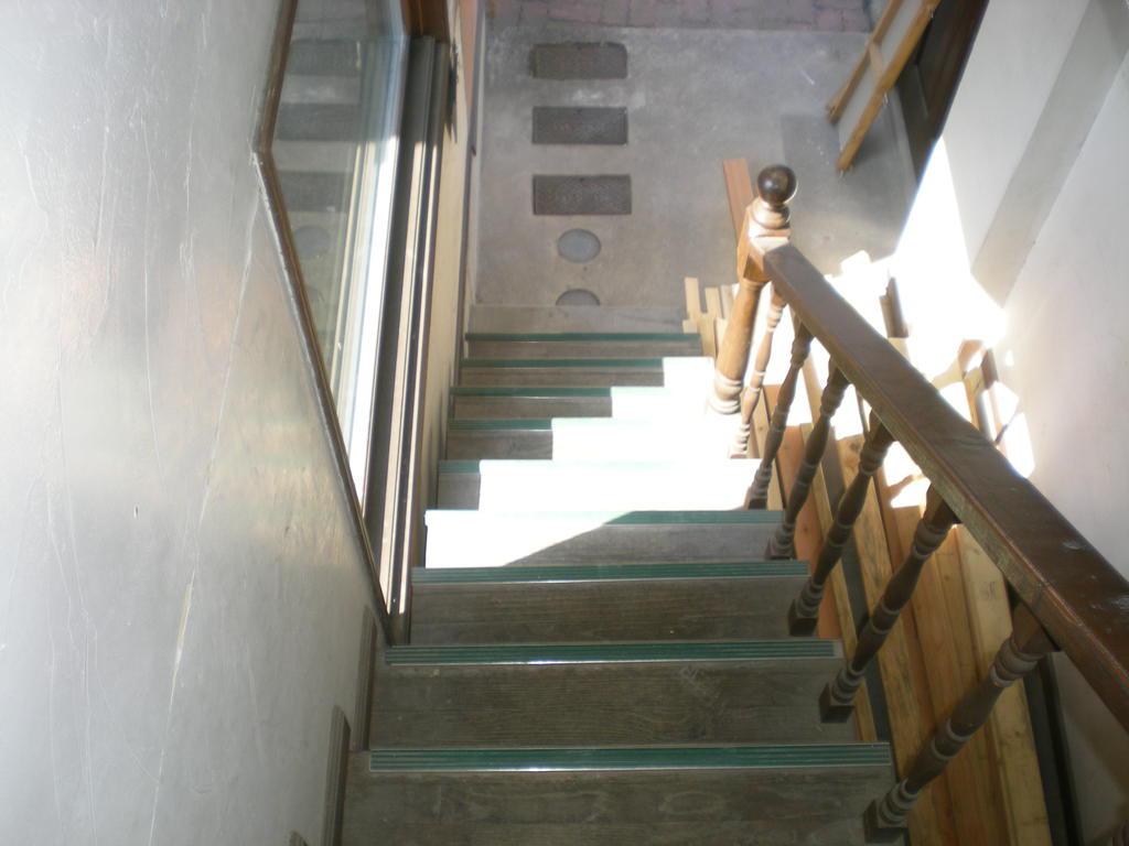 Other common areas. It is a staircase that goes up to the second floor