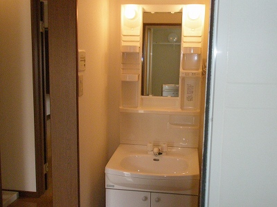 Washroom. Convenient basin with vanity in the morning of the dressing