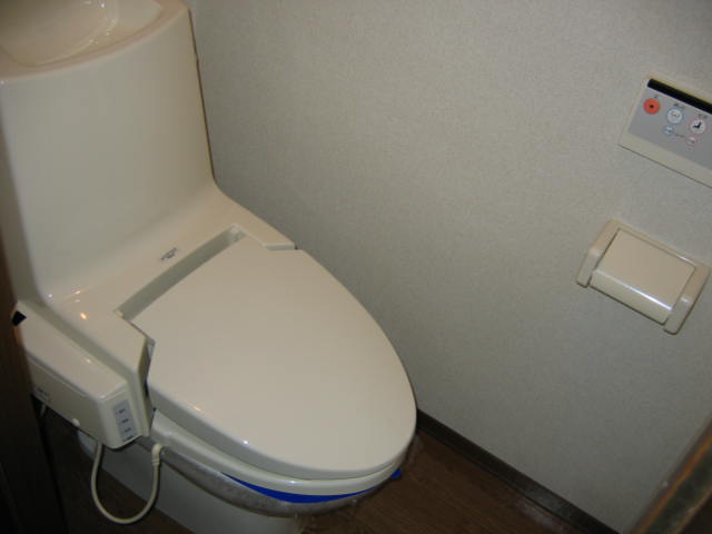 Toilet. A heated toilet seat