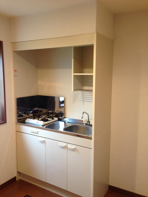 Kitchen. There is a window, Bright and a clean kitchen