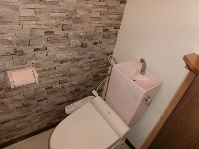 Toilet. Washlet equipped to cross the brick-like + with shelf