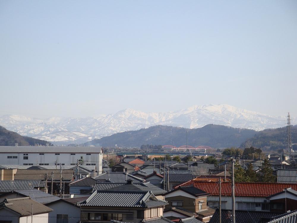 View photos from the dwelling unit. Is the view from the living room. It is the beautiful mountains of a sunny day.