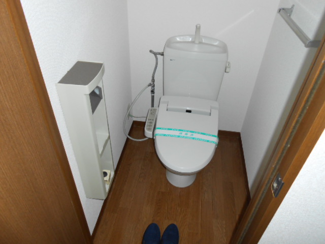 Toilet. It is with warm water washing toilet seat!