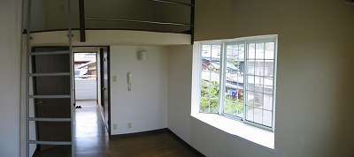 Living and room. Image is a corner room type.