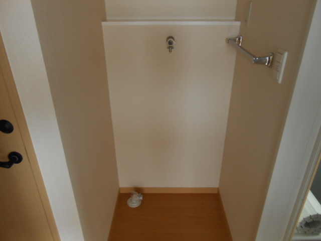 Washroom. It is indoor washing machine Storage! 