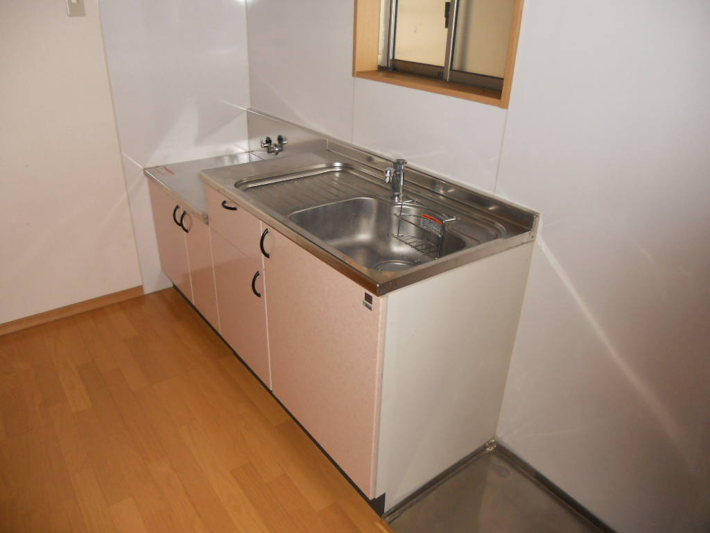 Kitchen. It is bright because the window on the south side kitchen is attached.