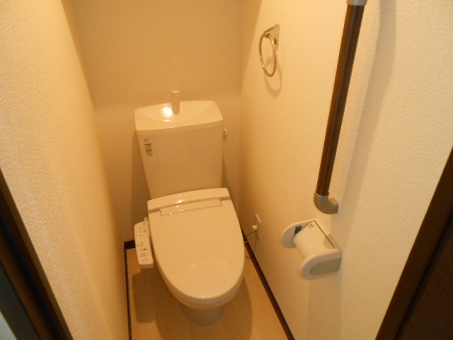 Toilet. It is with warm water washing toilet seat!