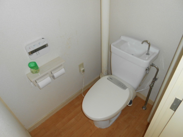 Toilet. It is with warm water washing toilet seat!