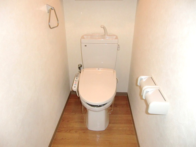 Toilet. It is a photograph of another room of the same properties