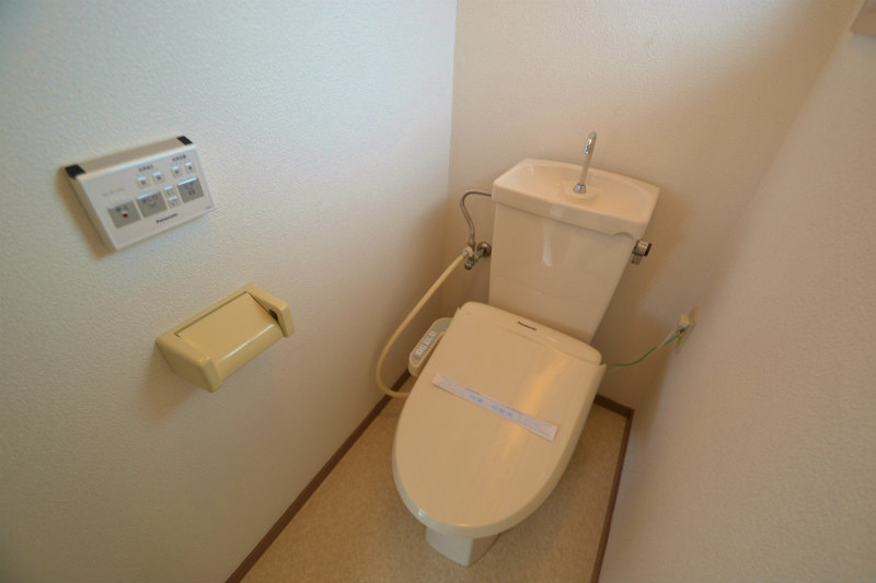 Toilet. It is bright because there is a window.