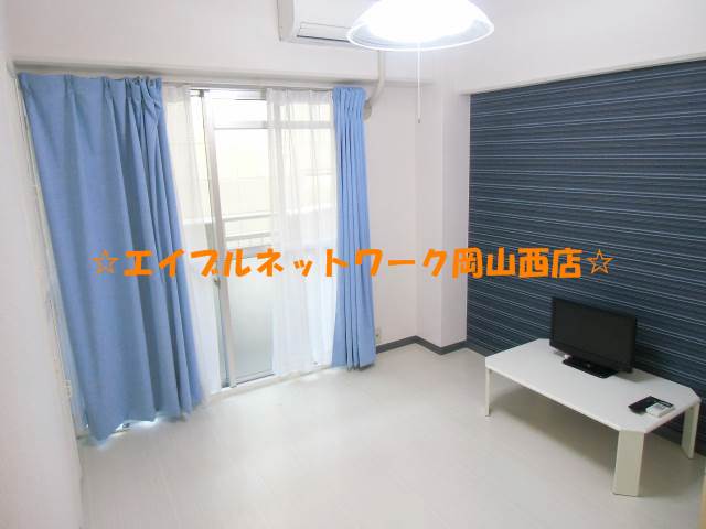 Living and room. It is a bright room