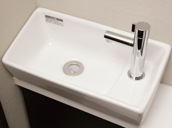Toilet.  [Hand wash counter (standard adopted)] Hand washing counter of functional and sleek. Also convenient storage space at the bottom.