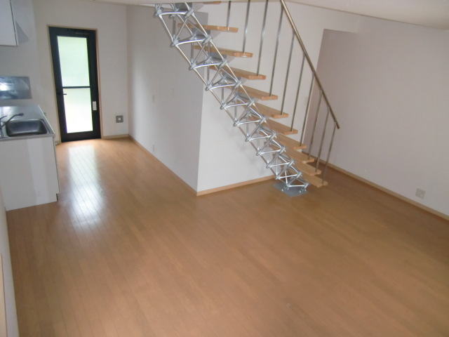 Living and room. It comes with a stylish staircase!