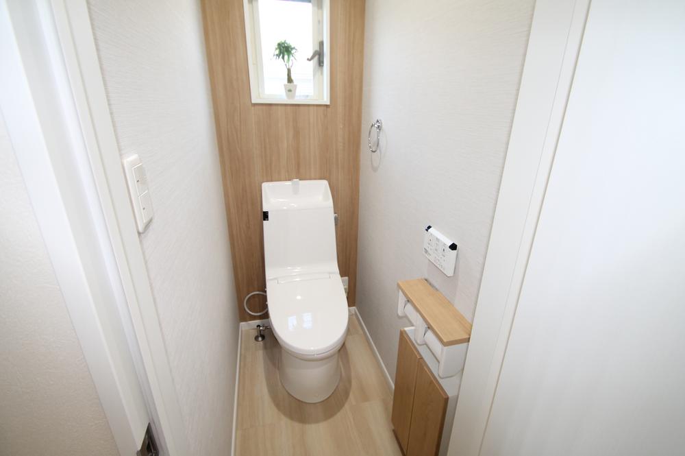 Toilet. Bright toilet, It is very convenient with storage.