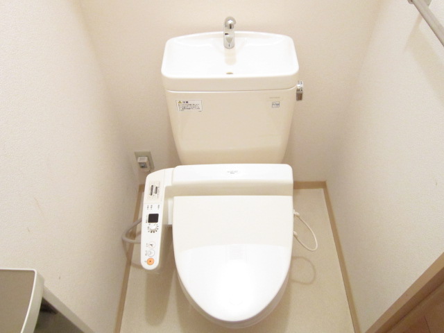 Toilet. Is a warm water washing toilet seat installed already