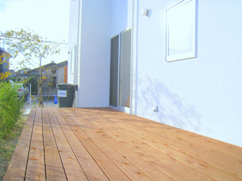 Local appearance photo. Wide wood deck