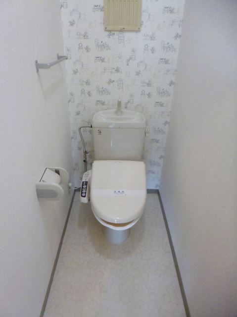 Toilet. Toilet is equipped with Washlet. Mickey wallpaper is cute! 
