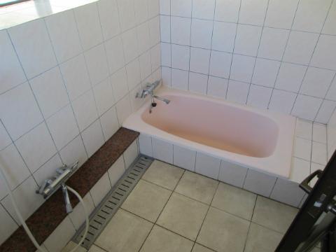 Bathroom. With unusual tub in Okinawa Shower is a hose already replaced.