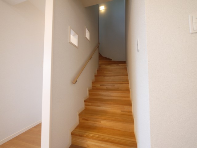 Other room space. Staircase with a warmth of wood
