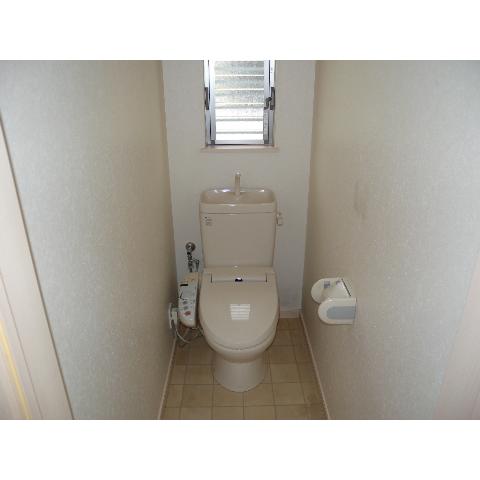 Toilet. The restroom small window. Hot-water heating cleaning toilet seat.