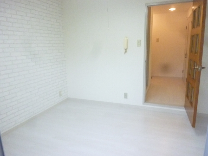 Living and room. It is bright with white flooring