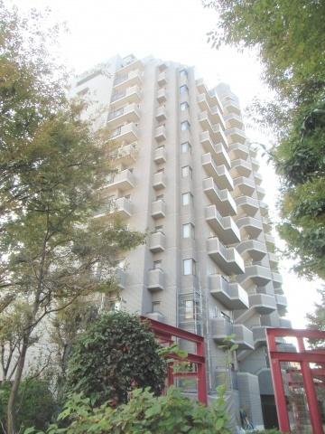 Local appearance photo. The ground is a 15-story apartment