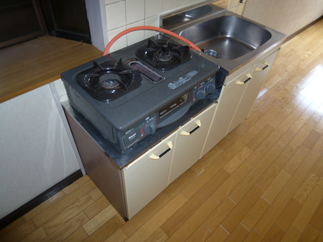 Kitchen. Gas stove is with a 2-neck
