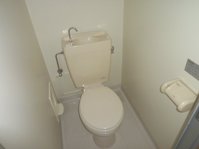 Toilet. It is pure white of clean toilet. 