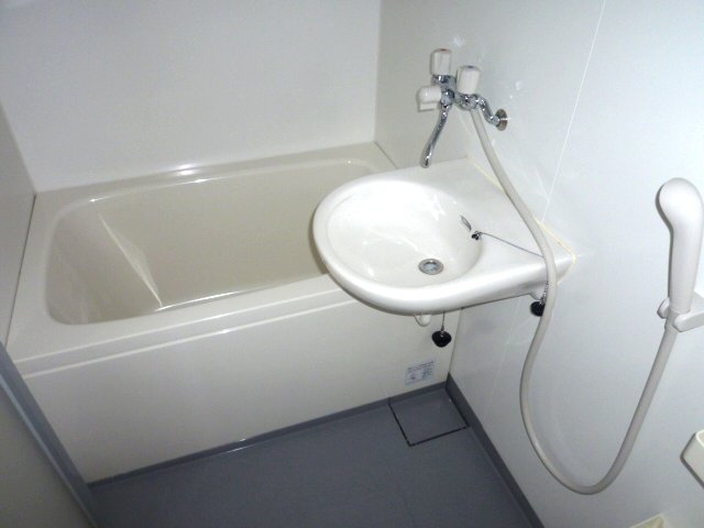 Bath. It is with the bathroom and wash basin. 