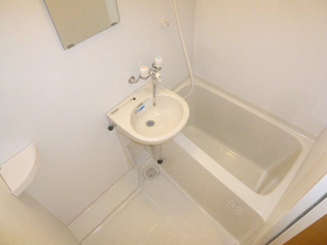 Bath. It is with the bathroom and wash basin. 