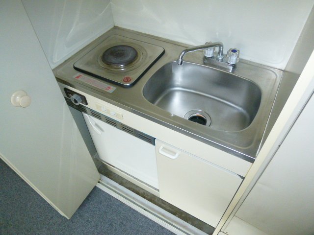 Kitchen. It is with electric stove. 
