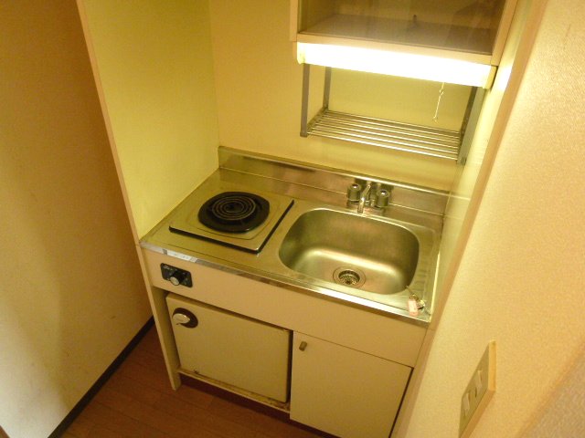 Kitchen. It is with a mini fridge. 