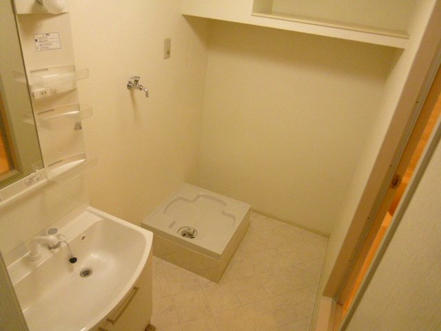 Washroom. Shampoo is a wash basin with a dresser