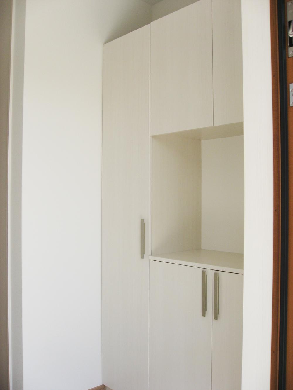 Entrance. Storage convenient cupboard. You can hold a lot of shoes.