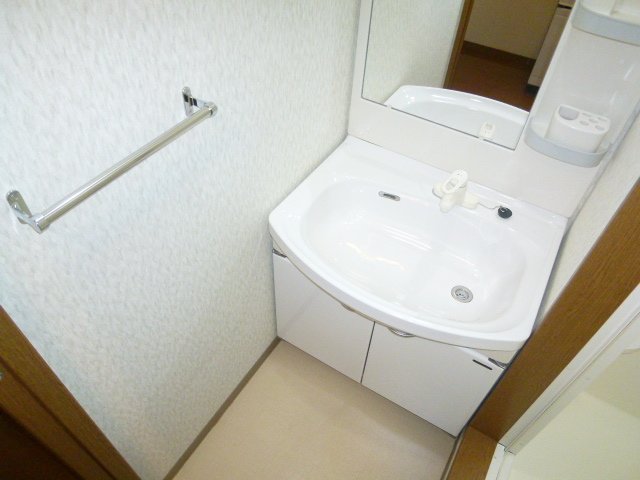 Washroom. It is a wash basin with a happy shampoo dresser for women. 