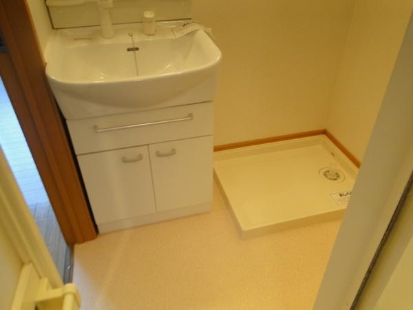 Washroom. There is also a wash basin with washing machine storage and shower in the dressing room