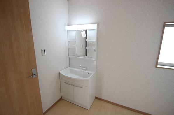 Wash basin, toilet. With bright lights. Mirror surface is also widely useful.