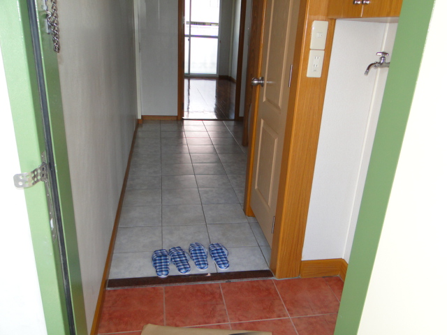Entrance. There is also a washing machine storage can be found at the front door