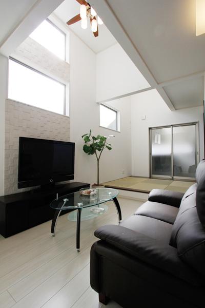 Living. By providing the stairwell to the top, It has become open and more spacious living space. (No. 6 land model house)