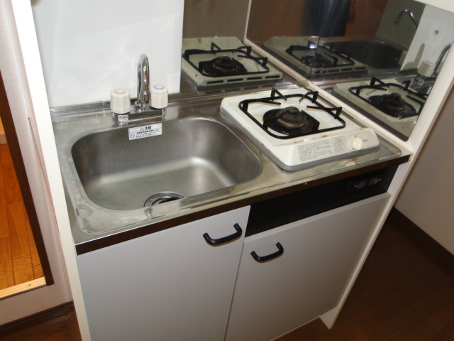 Kitchen. It is a gas stove with a kitchen