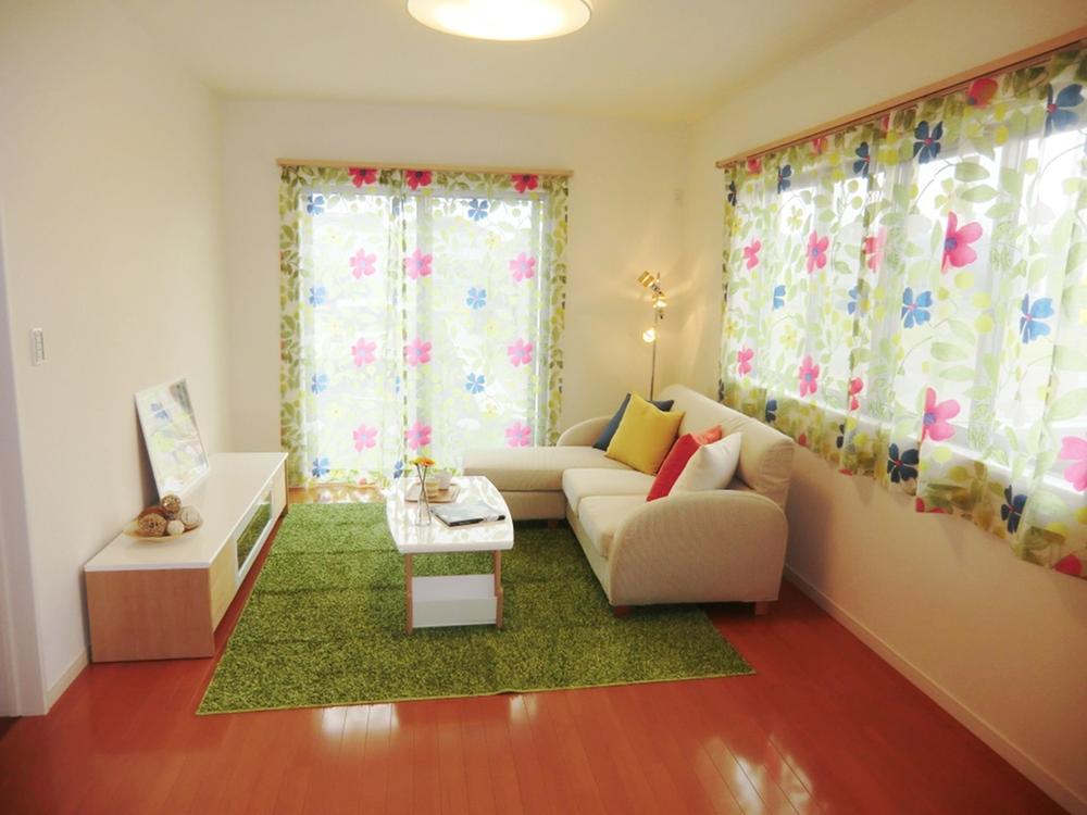 Living. Likely to brighter feeling window is large, bright living room