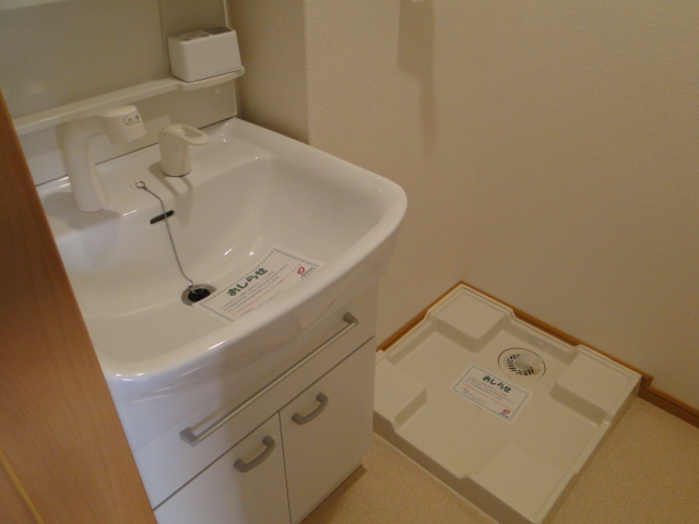 Washroom. There is a separate wash basin and an indoor laundry bread to dressing room